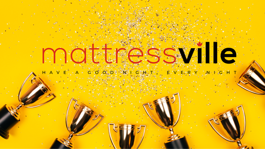 a group of trophies on a yellow background. Mattressville; have a good night, every night