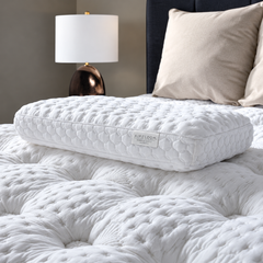 Aireloom Nimbus Visco Foam Pillow with open-cell foam and a removable TENCEL™ cover sitting on a mattress.