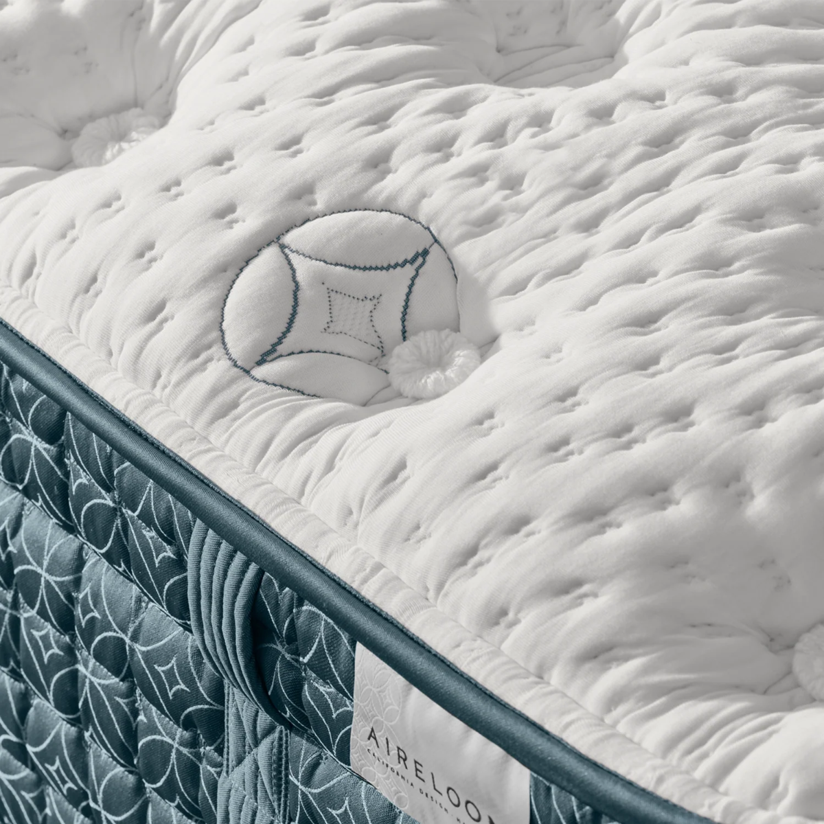 Mattress corner with Aireloom branding and white ticking