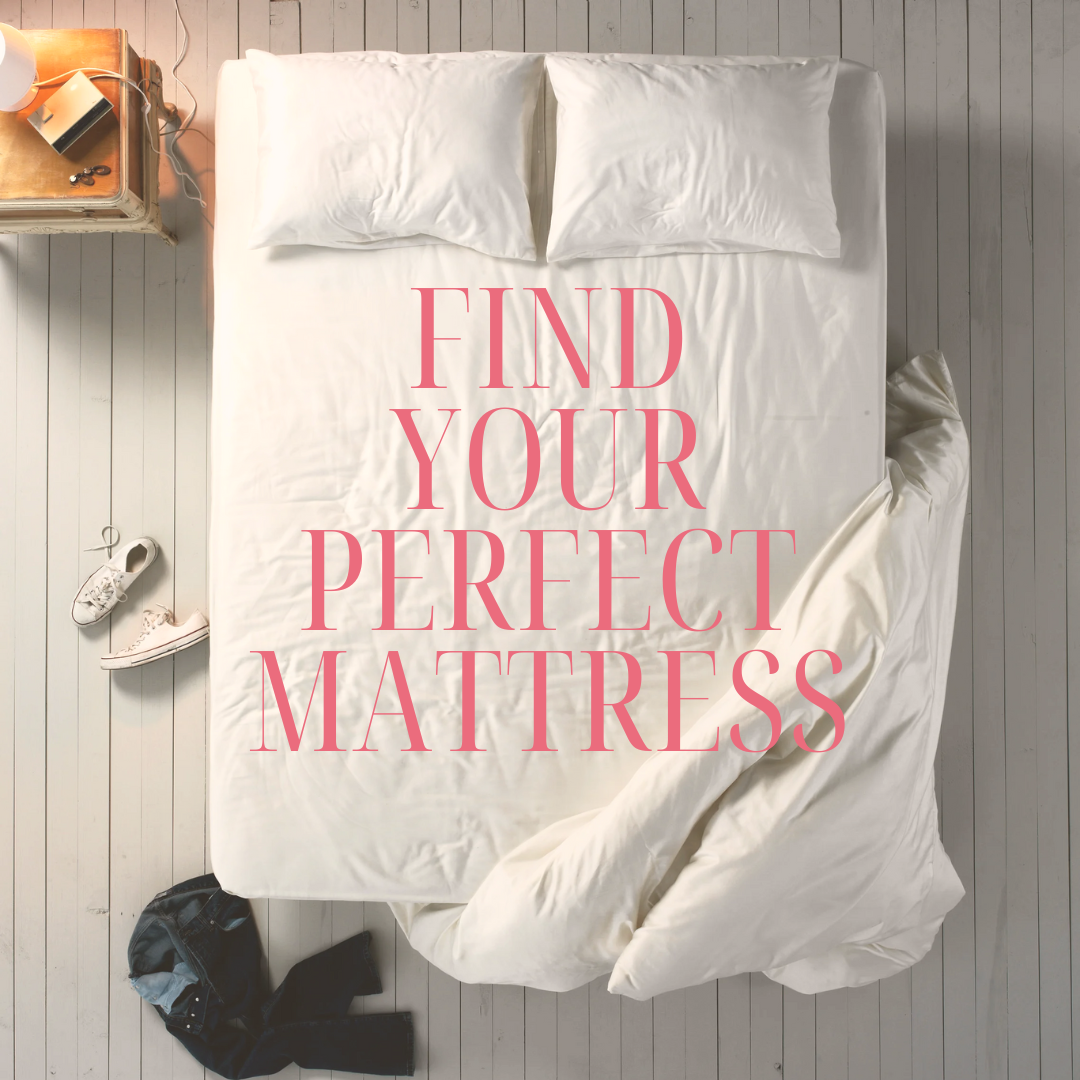 Top-down view of a neatly made bed with white sheets, two pillows, and a blanket partially pulled back. Text reads "Find Your Perfect Mattress." A nightstand with a lamp, book, phone, and visible shoes nearby suggest a cozy bedroom setting.-image