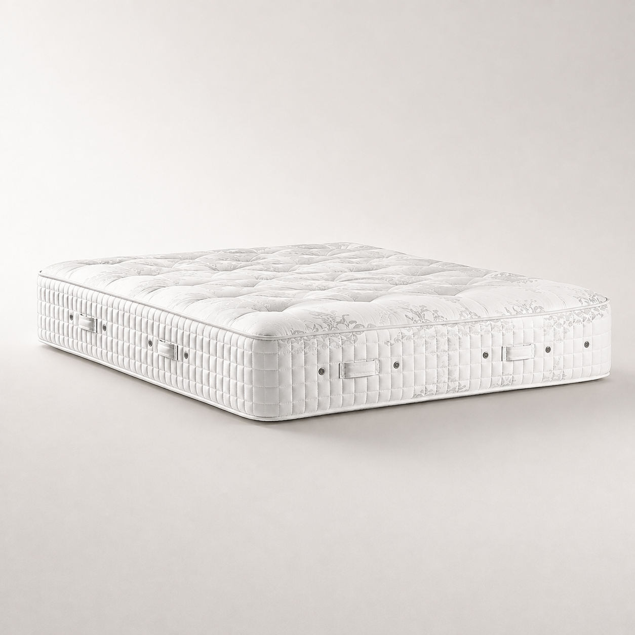 Hypnos Viceroy Sovereign two sided tufted premium mattress shown at an angle on a clean, light beige studio background.