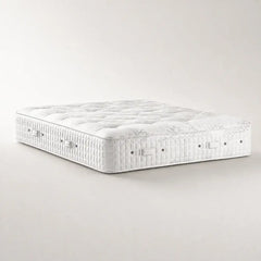 Hypnos Viceroy Sovereign two sided tufted premium mattress shown at an angle on a clean, light beige studio background.