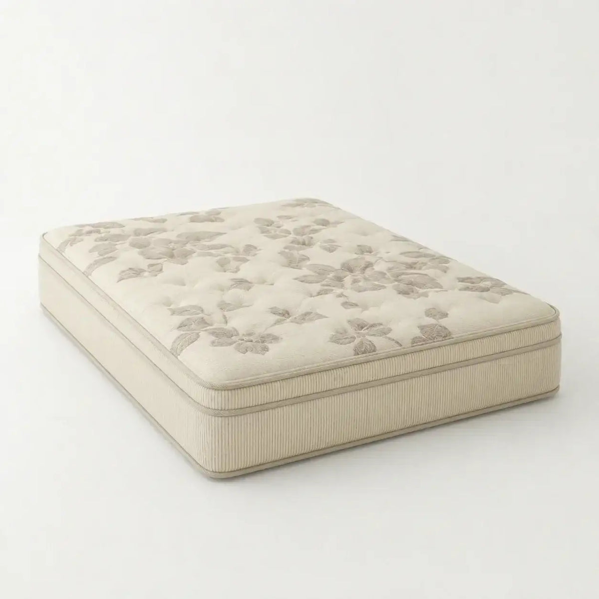 Natura Eco Brilliance Soft mattress with a floral patterned quilted top and ribbed sides, upholstered in a warm beige fabric, shown on a plain light background.