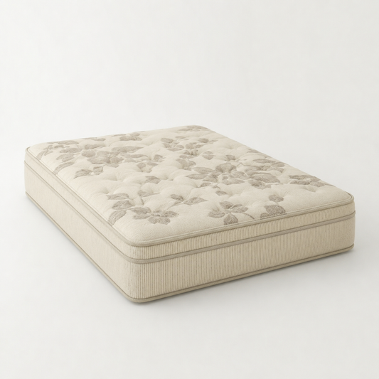 Natura Eco Brilliance Soft mattress with a floral patterned quilted top and ribbed sides, upholstered in a warm beige fabric, shown on a plain light background.