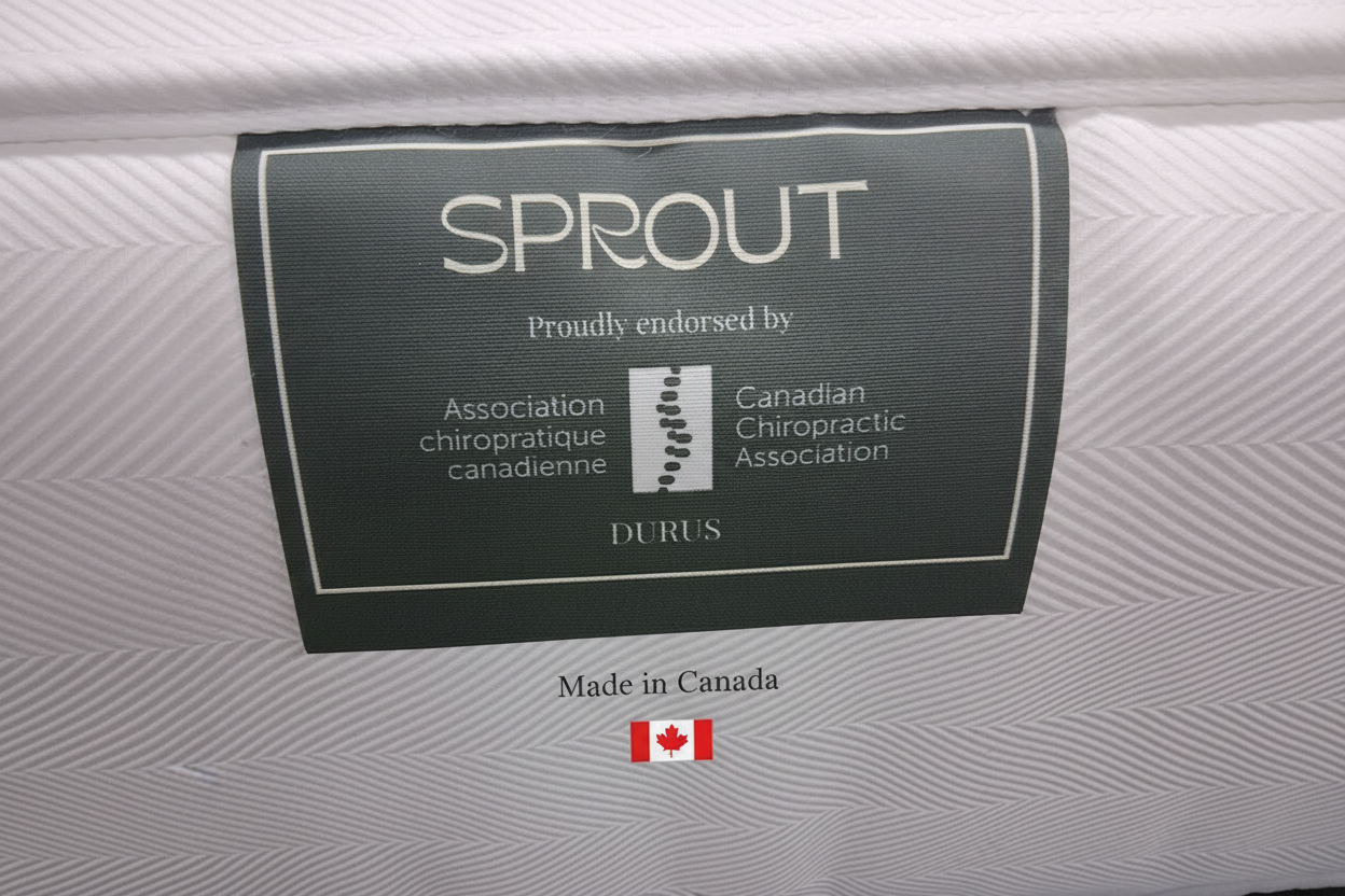 Sprout Durus mattress tag with Canadian Chiropractic Association endorsement on a white mattress background