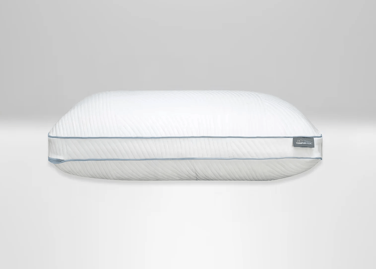 A white Tempur ProBlend pillow with a quilted, ribbed texture and a thin light blue piping detail along the edge, shown against a neutral light gray background.