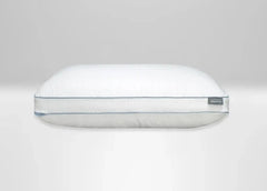 A white Tempur ProBlend pillow with a quilted, ribbed texture and a thin light blue piping detail along the edge, shown against a neutral light gray background.