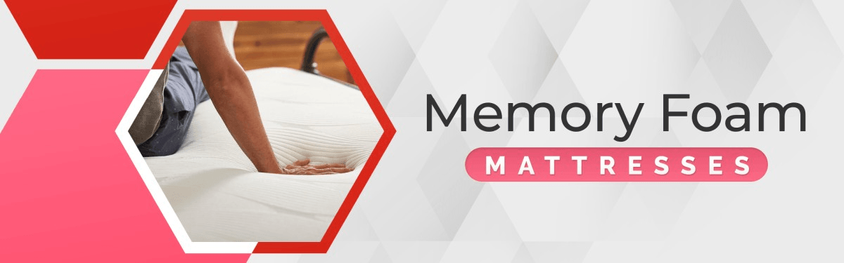 a person sitting on a memory foam mattress, with hand pressing on the memory foam. Memory foam mattresses